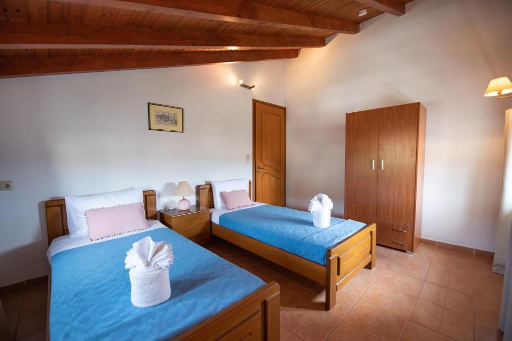 Postel nebo postele na pokoji v ubytování Mirmidones Corfu Apartment