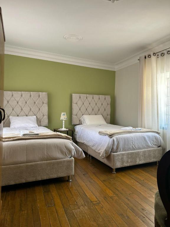 Ένα ή περισσότερα κρεβάτια σε δωμάτιο στο Casona Checacupe