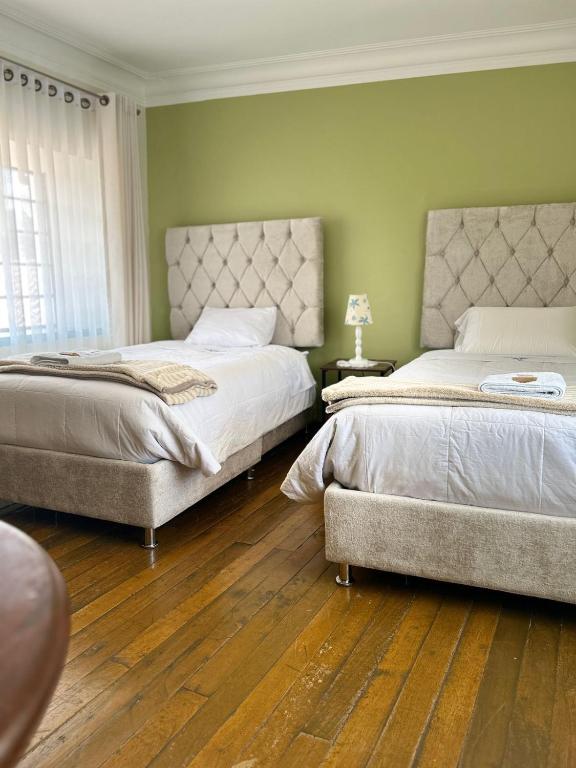 Ένα ή περισσότερα κρεβάτια σε δωμάτιο στο Casona Checacupe