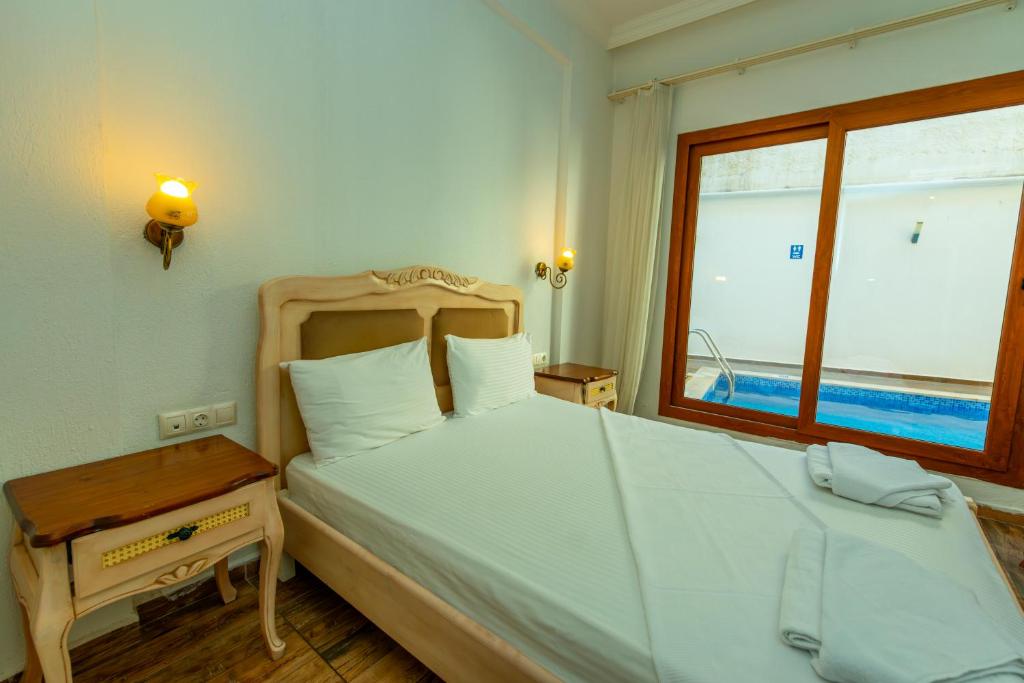 Postel nebo postele na pokoji v ubytování Cennet Life Hotel