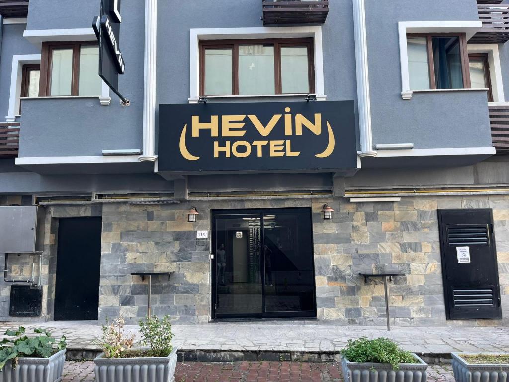 a hotel sign on the side of a building at HEVİN Otel in Bursa