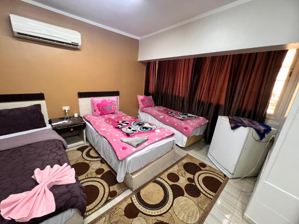 Postel nebo postele na pokoji v ubytování Isis Hostel 2