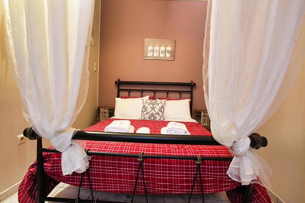 A bed or beds in a room at Venetis Luxury Apartments