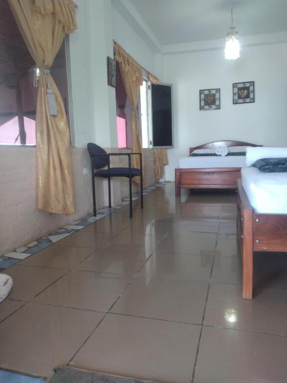 Postel nebo postele na pokoji v ubytování Hospedaje Algarrobo Machalilla
