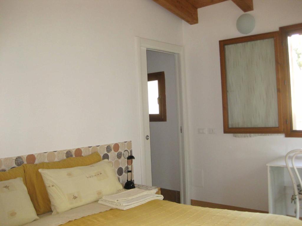 Posteľ alebo postele v izbe v ubytovaní Country House-B&B-Appartamenti Ai Cipressi