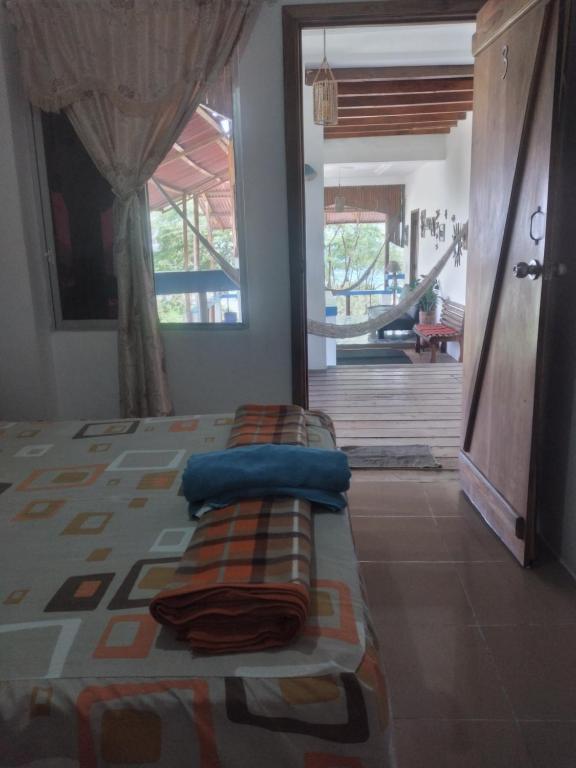 Postel nebo postele na pokoji v ubytování Hospedaje Algarrobo Machalilla