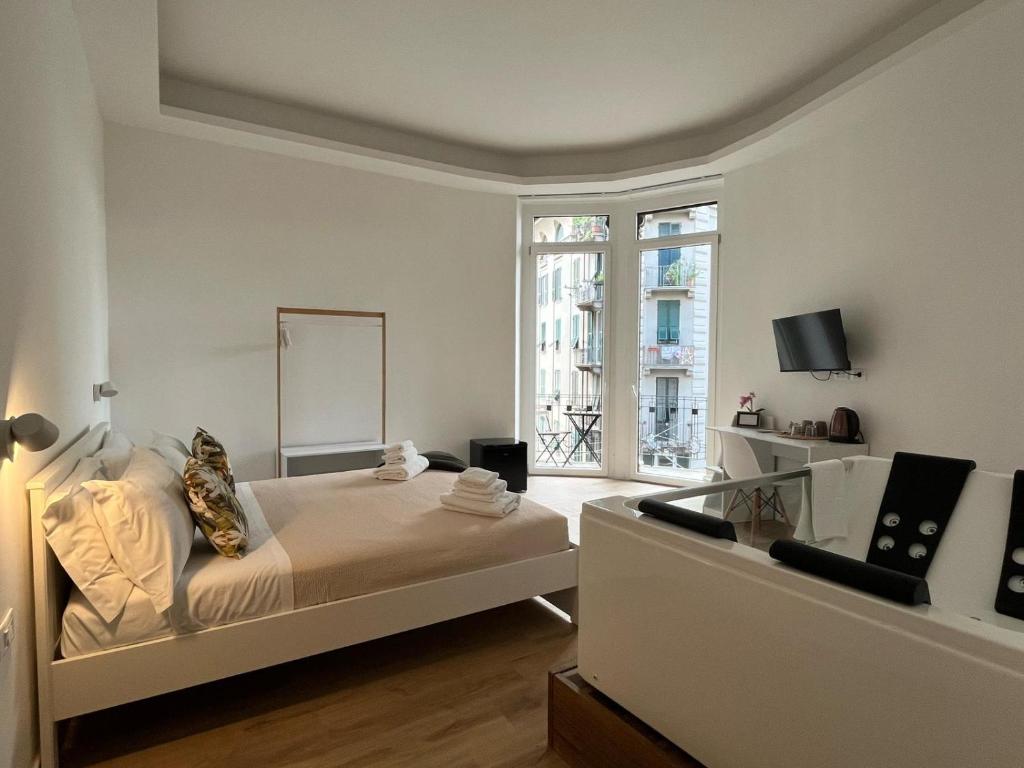 Postel nebo postele na pokoji v ubytování 20 Settembre Rooms