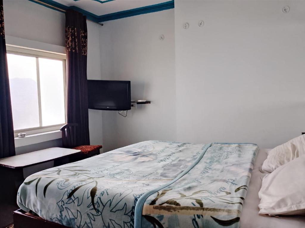 Postel nebo postele na pokoji v ubytování HOTEL GRAND GLORRYy