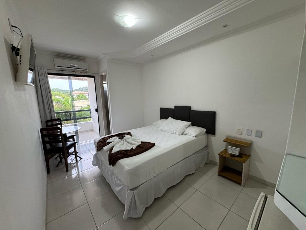 Postel nebo postele na pokoji v ubytování Pousada Paulett's - Hospedagem na Zona Norte de Ilhéus - Bahia