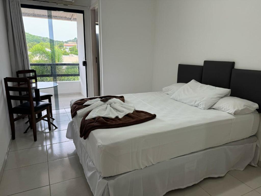 Postel nebo postele na pokoji v ubytování Pousada Paulett's - Hospedagem na Zona Norte de Ilhéus - Bahia