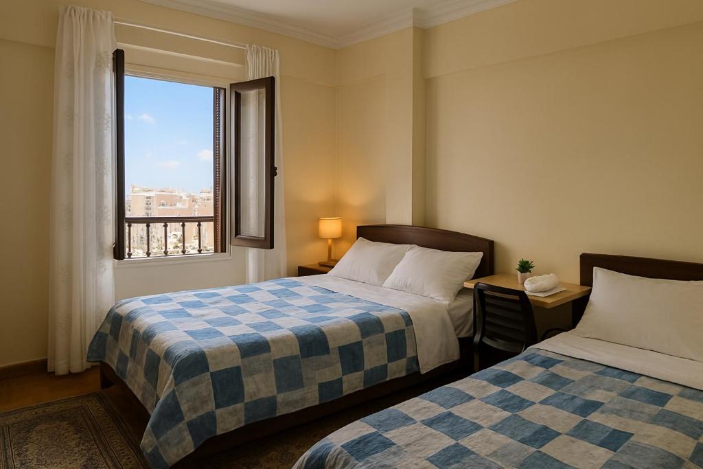 Postel nebo postele na pokoji v ubytování Downtown Alexandria Apartment