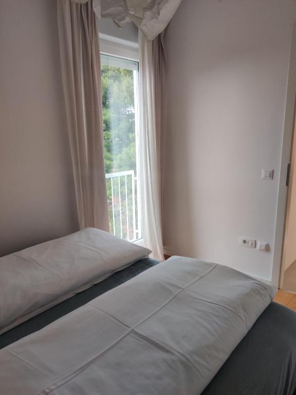 Llit o llits en una habitació de Mint Apartment