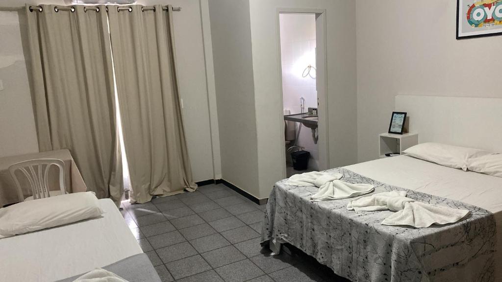 Letto o letti in una camera di Piúma Palace Hotel