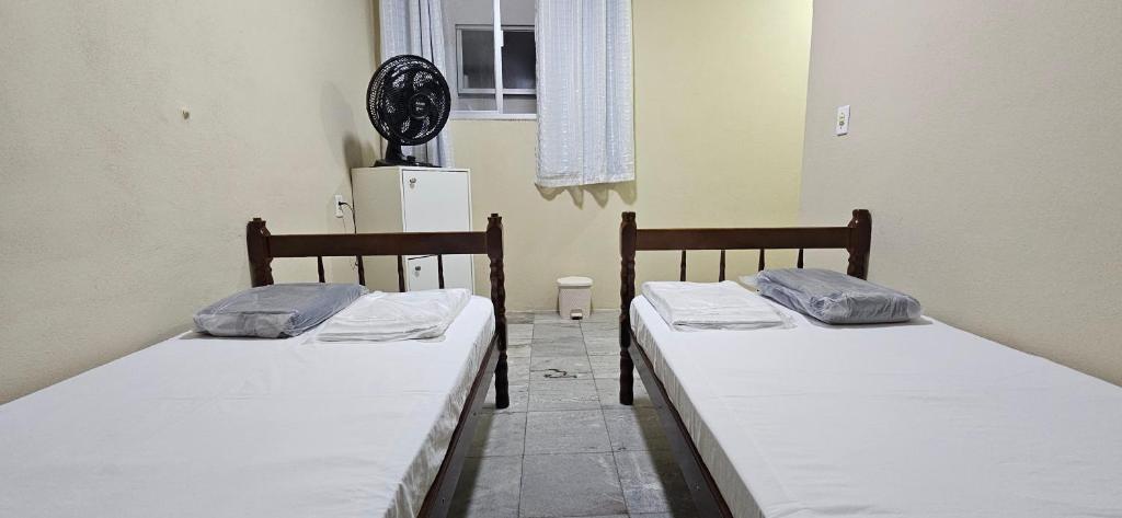 Postel nebo postele na pokoji v ubytování CAXU HOSTEL