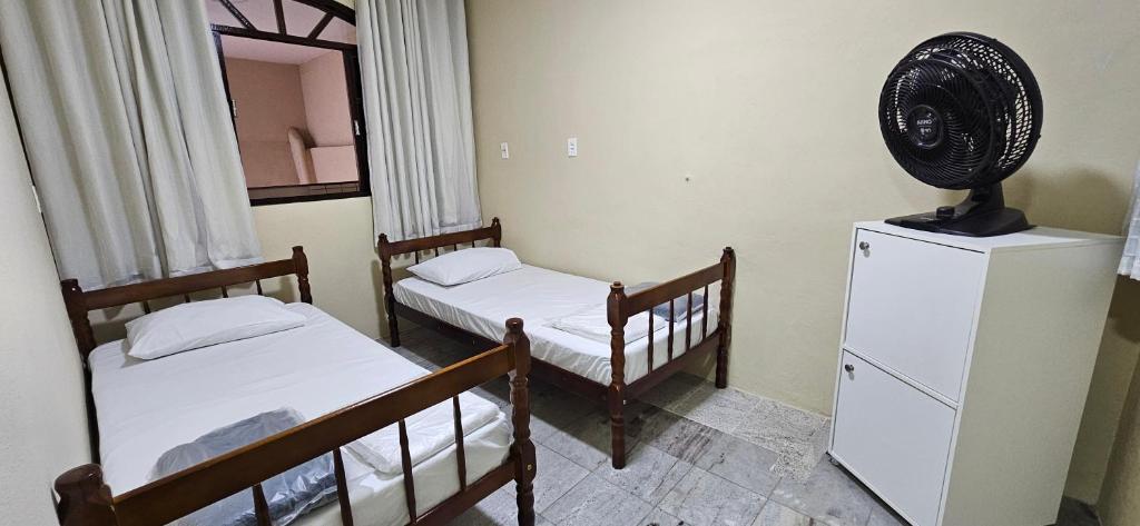 Postel nebo postele na pokoji v ubytování CAXU HOSTEL