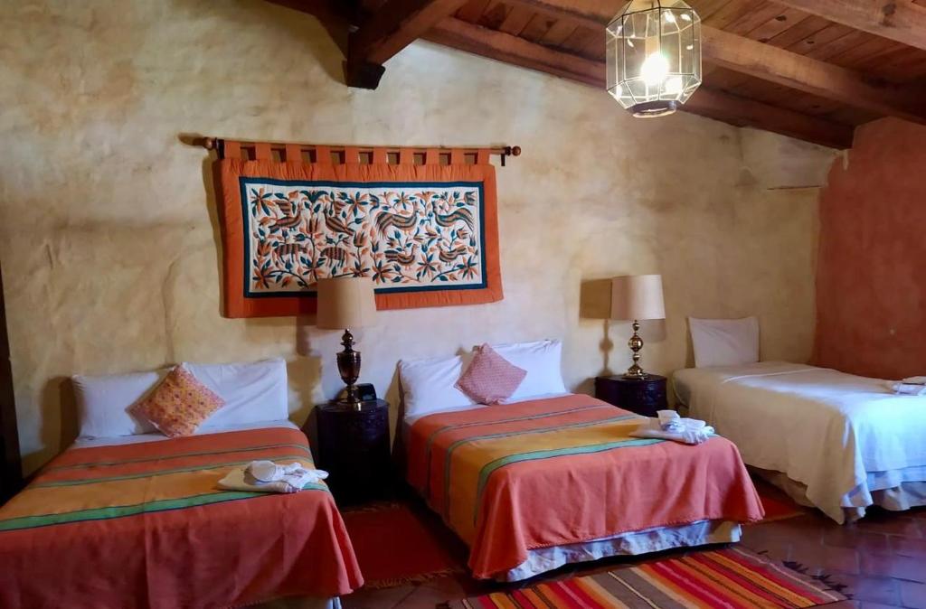 Postel nebo postele na pokoji v ubytování Hotel Casona de Manzano