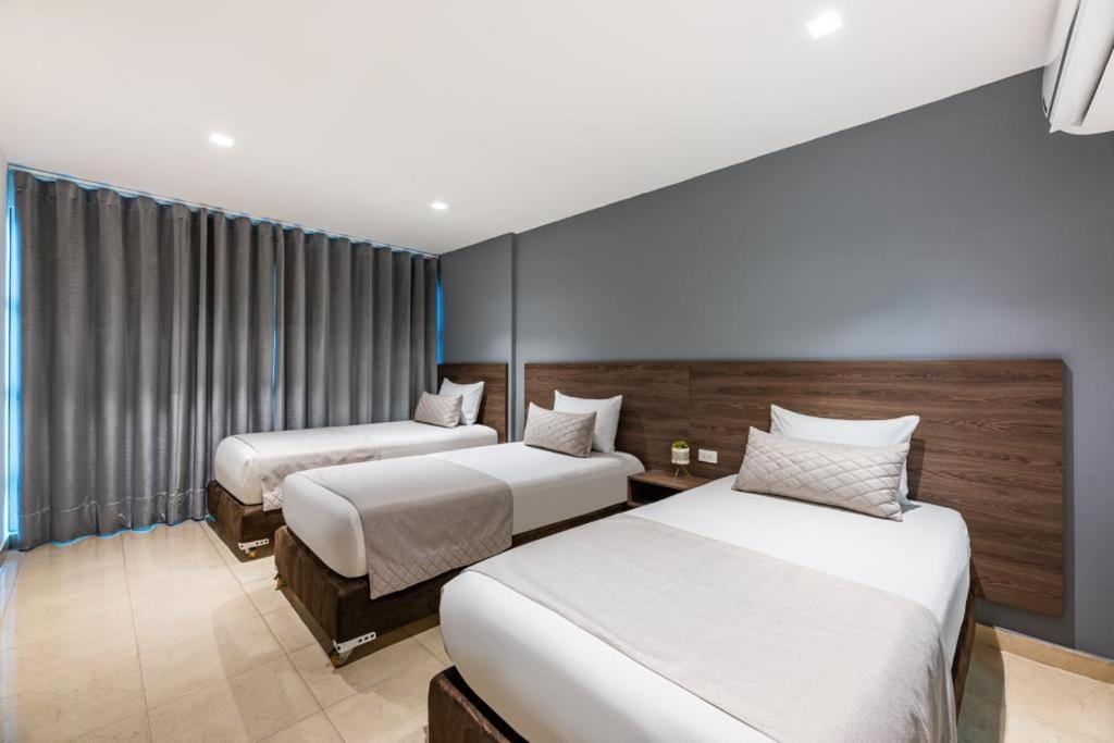 Postel nebo postele na pokoji v ubytování Hotel Elite