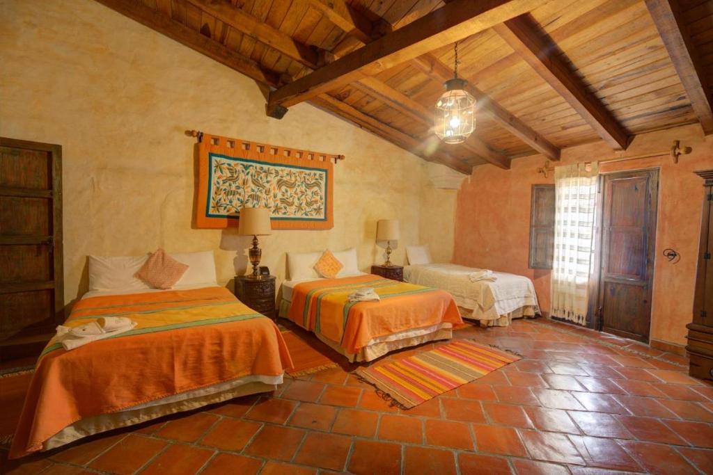 Postel nebo postele na pokoji v ubytování Hotel Casona de Manzano