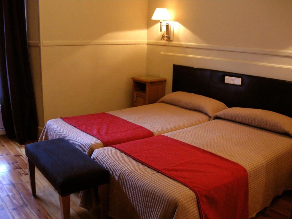 Postel nebo postele na pokoji v ubytování Hostal Canovas