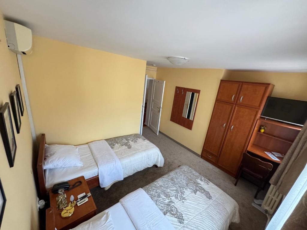 Postel nebo postele na pokoji v ubytování Ada Apartments