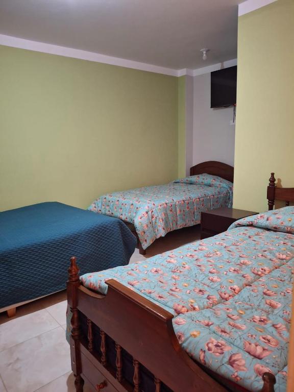 Postel nebo postele na pokoji v ubytování Hotel Incas Suite, con Aguas Termomedicinales