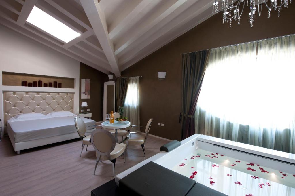 Postel nebo postele na pokoji v ubytování Hotel Morgana