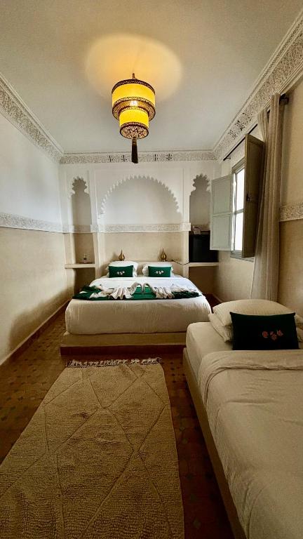 Postel nebo postele na pokoji v ubytování Riad Magnolia&SPA
