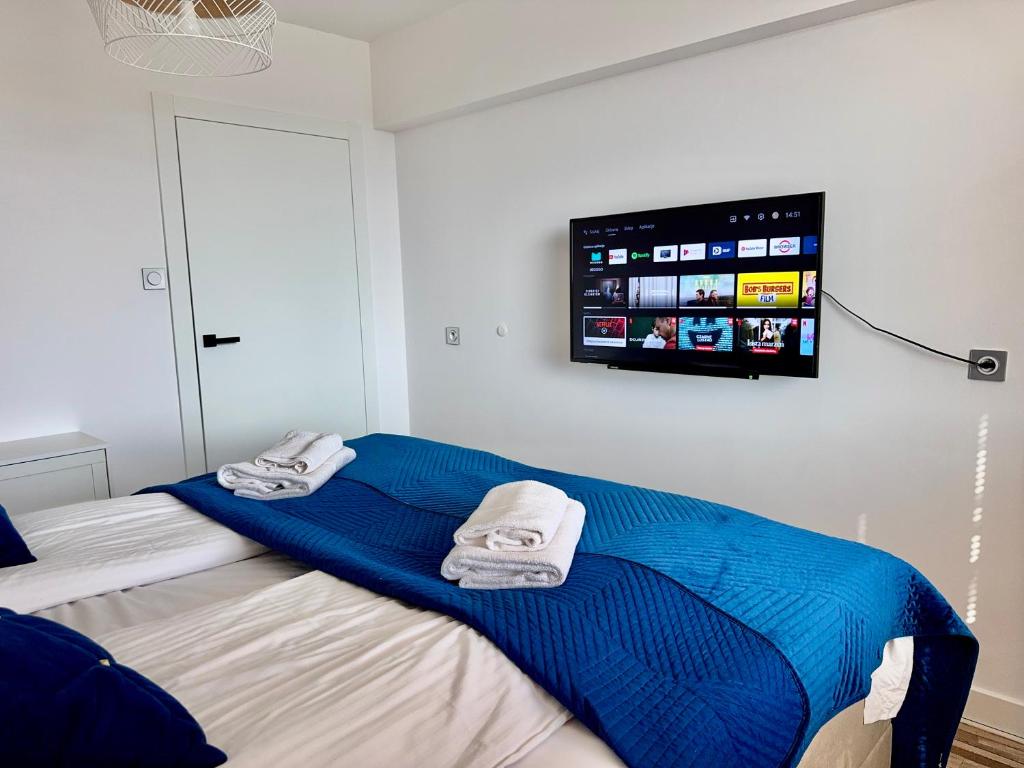 Postel nebo postele na pokoji v ubytování Comfy Apartments - Transatlantyk Lux