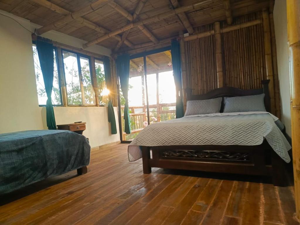 Postel nebo postele na pokoji v ubytování El Chalet Ecoposada