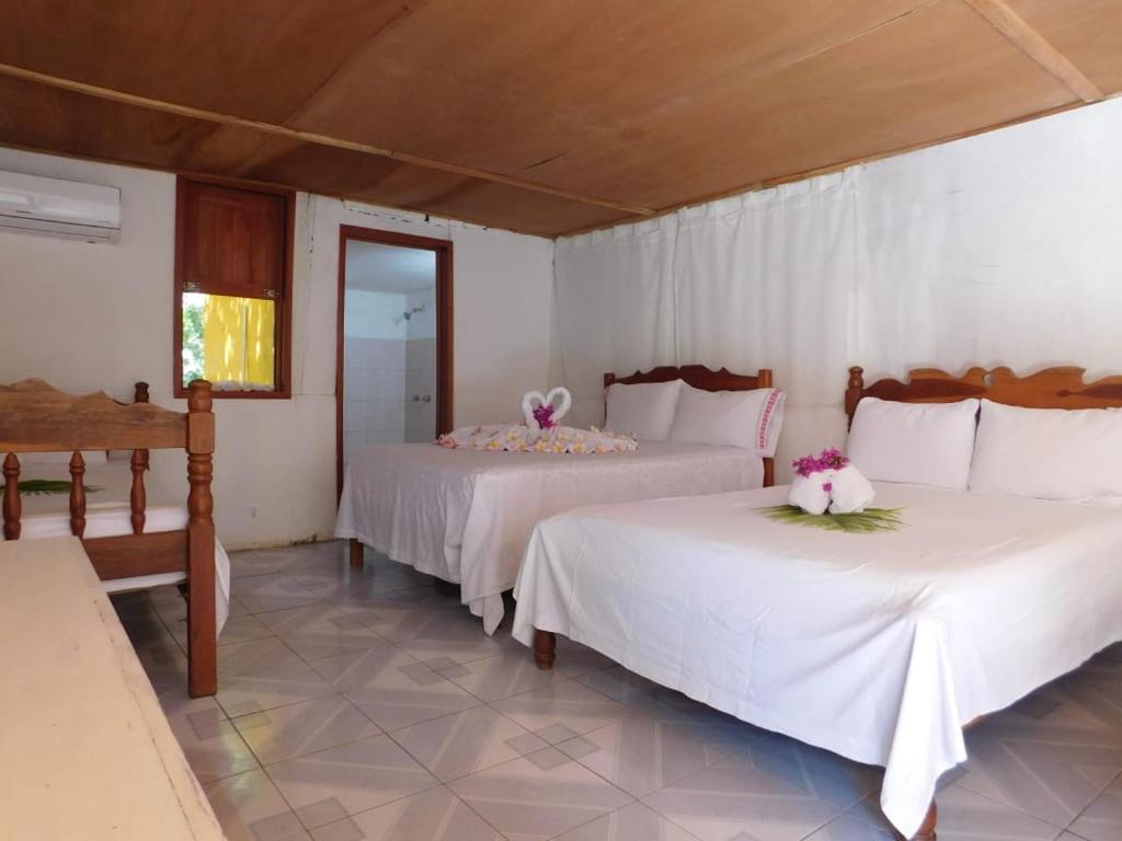 Postel nebo postele na pokoji v ubytování Posada los Reyecitos