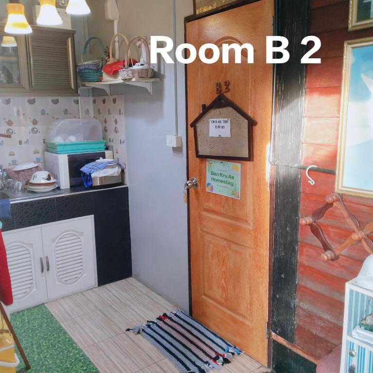 Kuchyň nebo kuchyňský kout v ubytování Ban Kru Ae HomeHostel