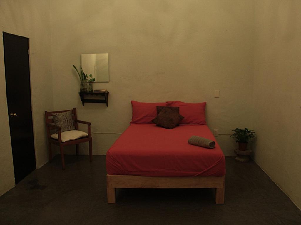 Postel nebo postele na pokoji v ubytování El Pinche Hostal