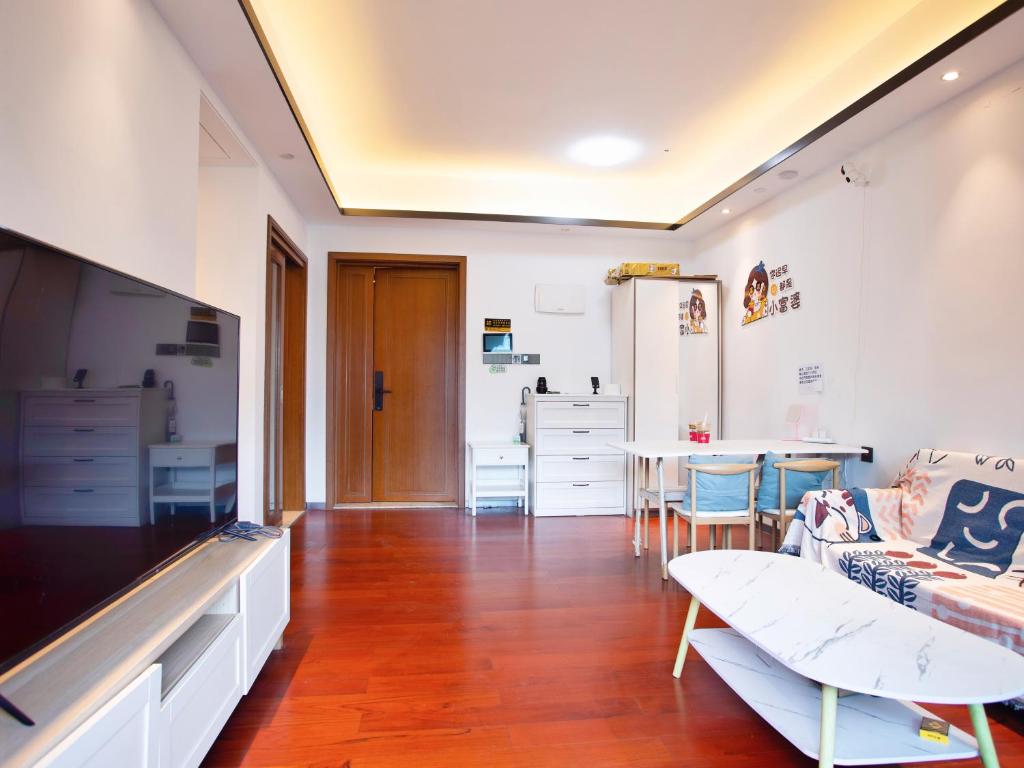TV a/nebo společenská místnost v ubytování Yiweidu Youth Apartment