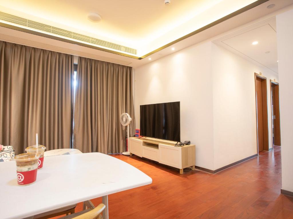 TV a/nebo společenská místnost v ubytování Yiweidu Youth Apartment