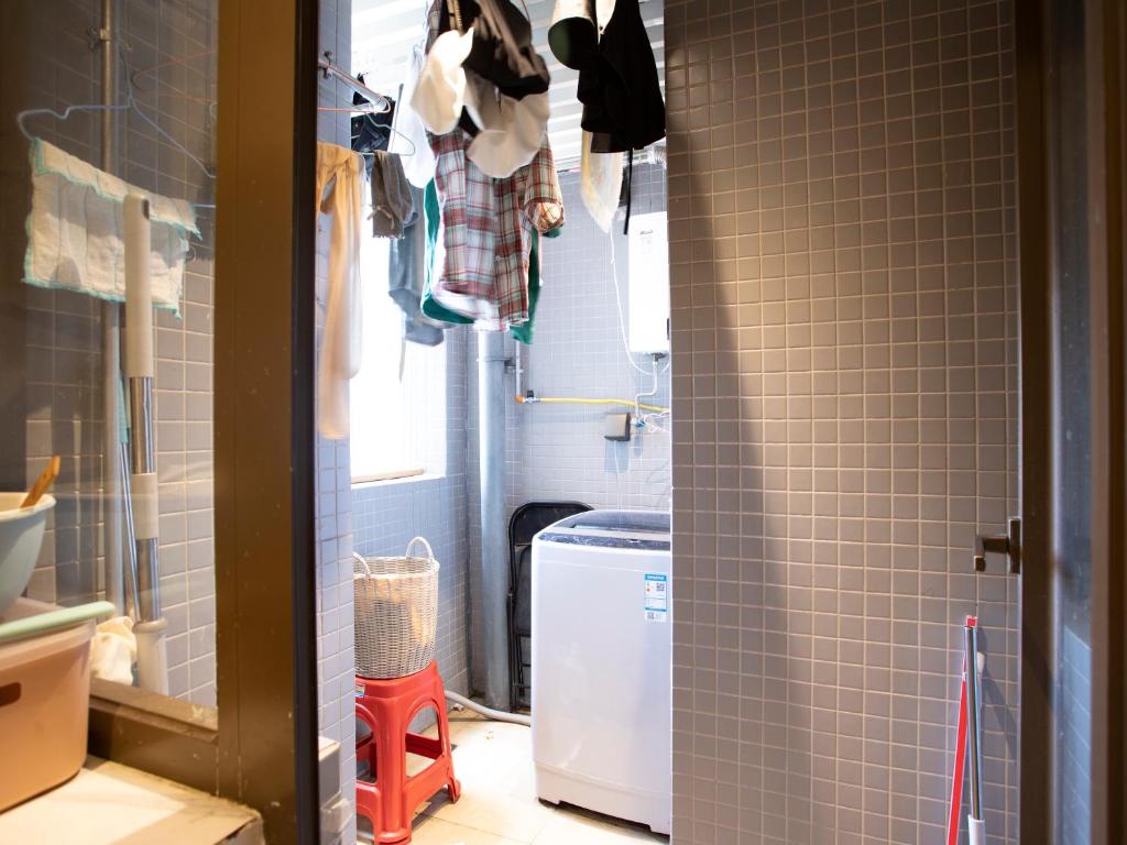 Koupelna v ubytování Yiweidu Youth Apartment