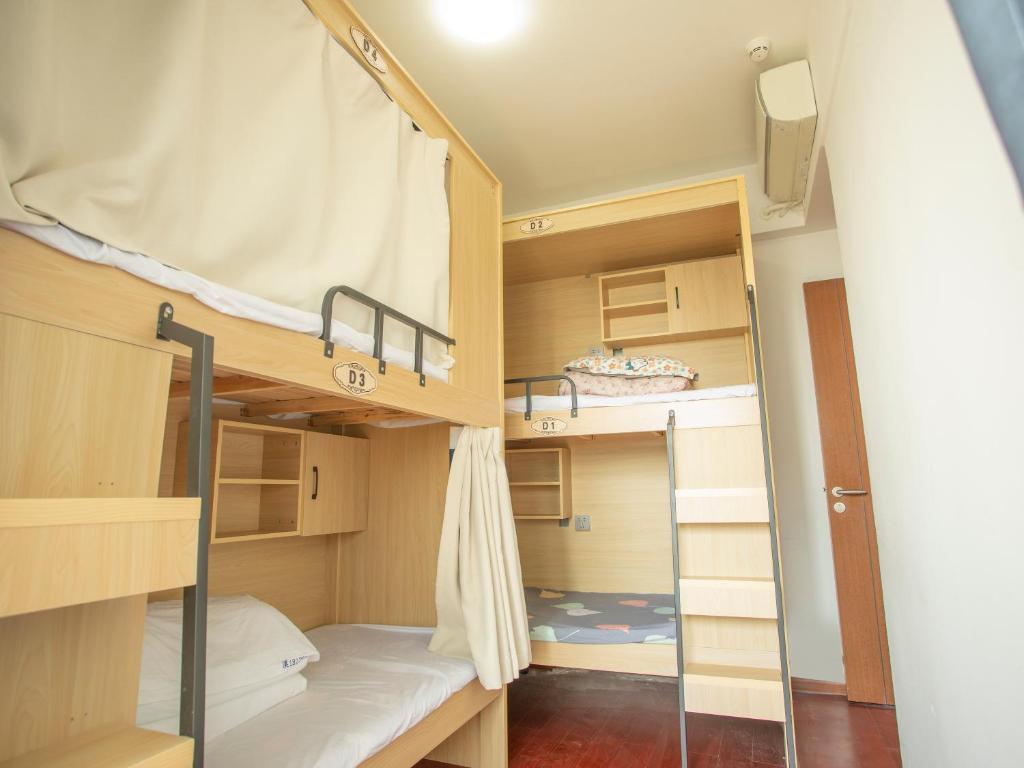 Kuchyň nebo kuchyňský kout v ubytování Yiweidu Youth Apartment