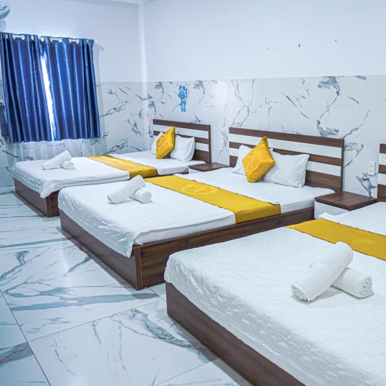 Postel nebo postele na pokoji v ubytování Khách Sạn Thanh Xuân