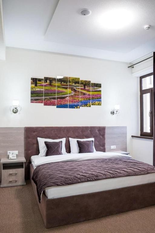 Postel nebo postele na pokoji v ubytování The Level Hotel