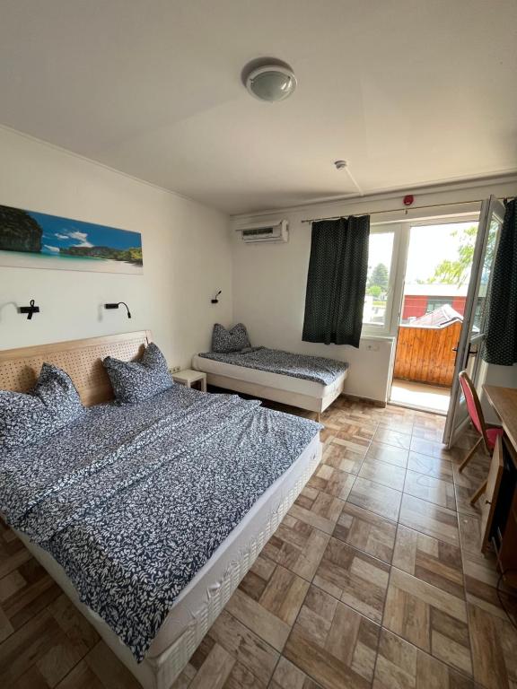 Postel nebo postele na pokoji v ubytování Centrum Motel