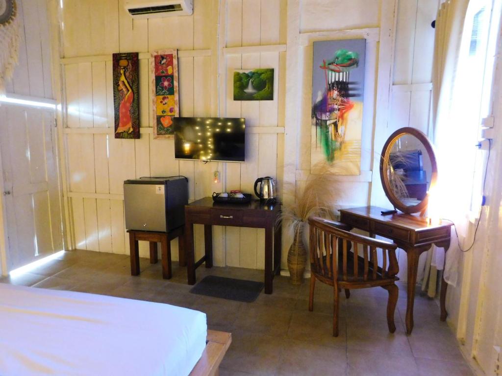 Postel nebo postele na pokoji v ubytování Lotus & Teak Villas