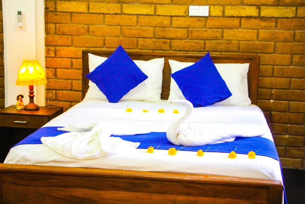 Postel nebo postele na pokoji v ubytování Sigiriya Dream Inn