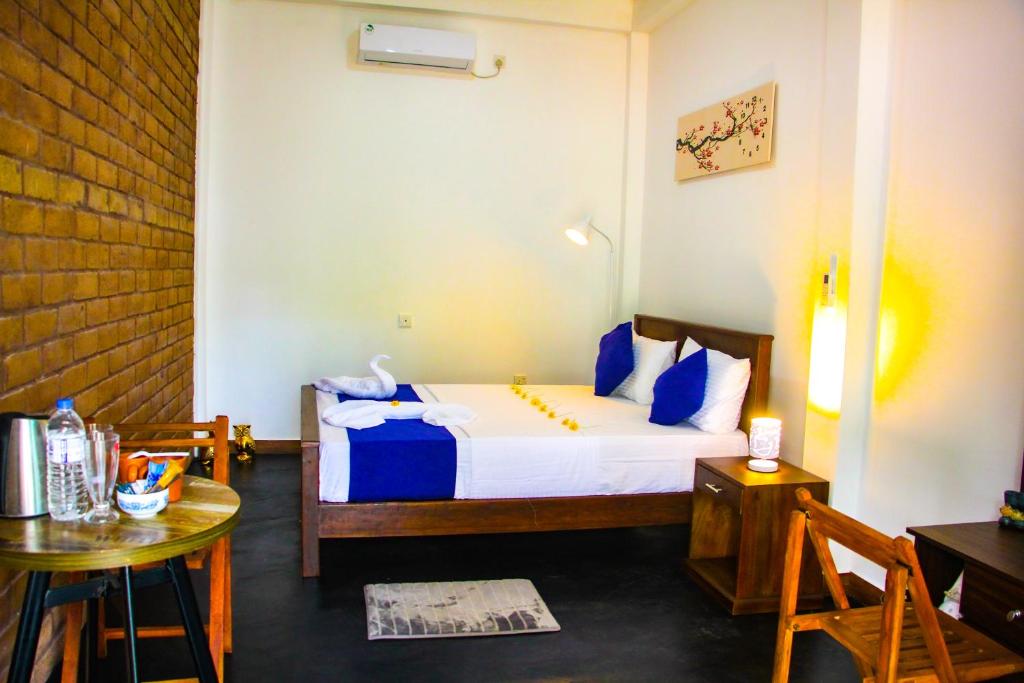 Postel nebo postele na pokoji v ubytování Sigiriya Dream Inn