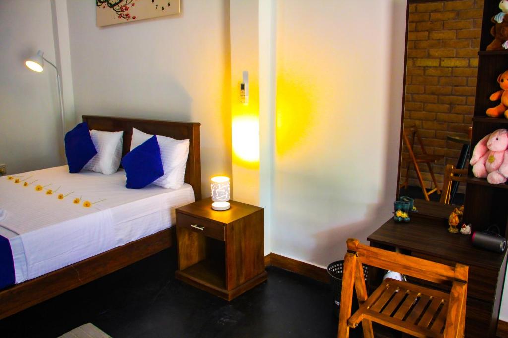 Postel nebo postele na pokoji v ubytování Sigiriya Dream Inn