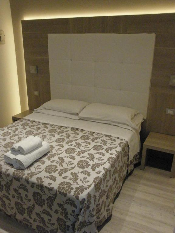 Postel nebo postele na pokoji v ubytování Hotel Stefan Room & Breakfast