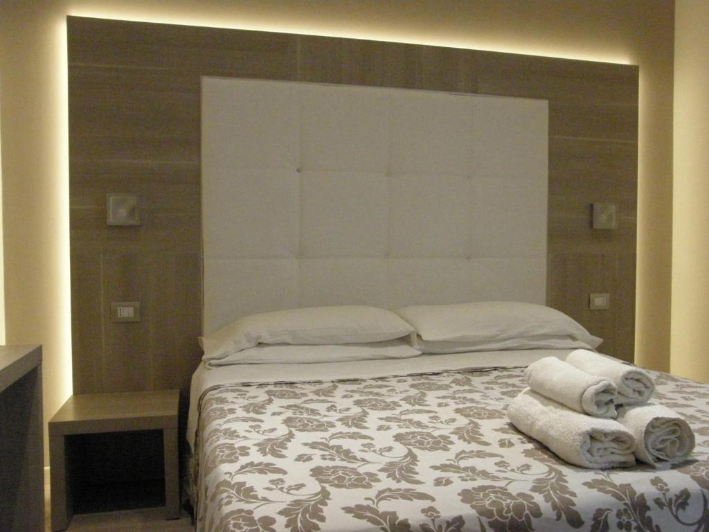 Postel nebo postele na pokoji v ubytování Hotel Stefan Room & Breakfast