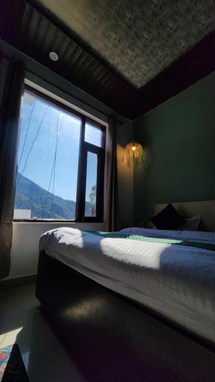 Postel nebo postele na pokoji v ubytování Hotel Mahadev