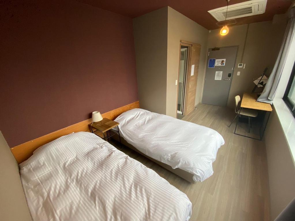 WISE OWL HOSTELS SAPPOROにあるベッド