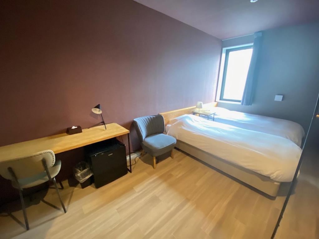 WISE OWL HOSTELS SAPPOROにあるベッド