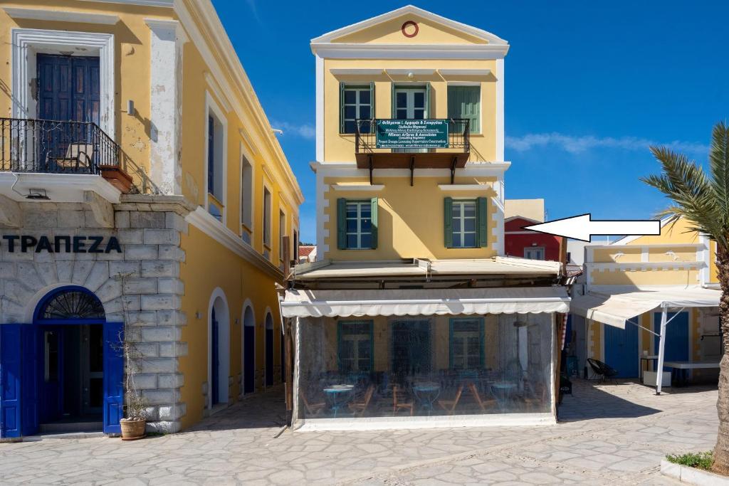 a group of buildings on a street at Agkyra Studio in Symi