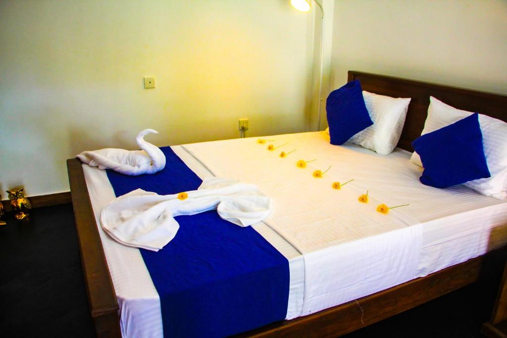 Postel nebo postele na pokoji v ubytování Sigiriya Dream Inn